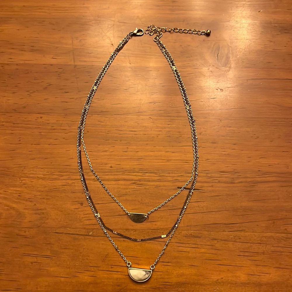 Tiered choker necklace with faux stone pendant.